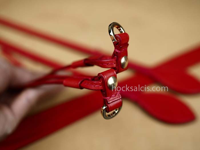Red bag straps crafted to replace lv bag's worn out bag straps