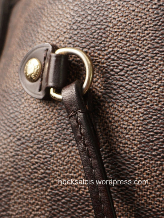 New bag strap replacement attached to D-ring of LV bag