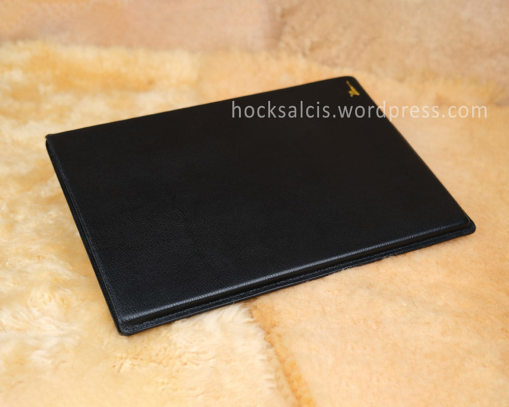 Wet molded edge of customised black goat skin leather laptop sleeve