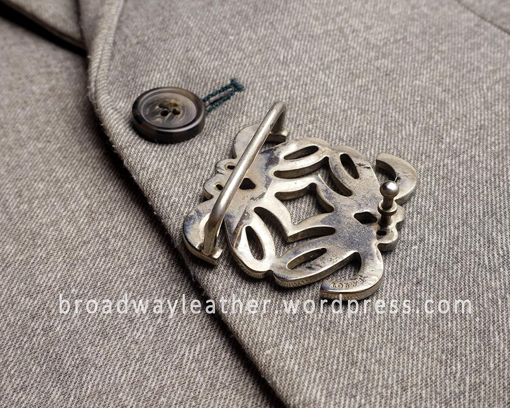Tarnished and oxidised underside of Loewe belt buckle.