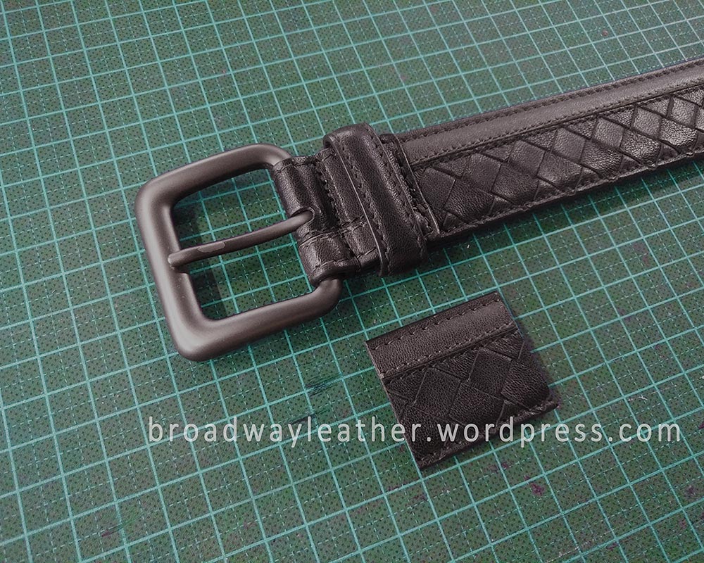 A shortened Bottega Veneta belt, with a segment of the cut off leather strap next to the belt
