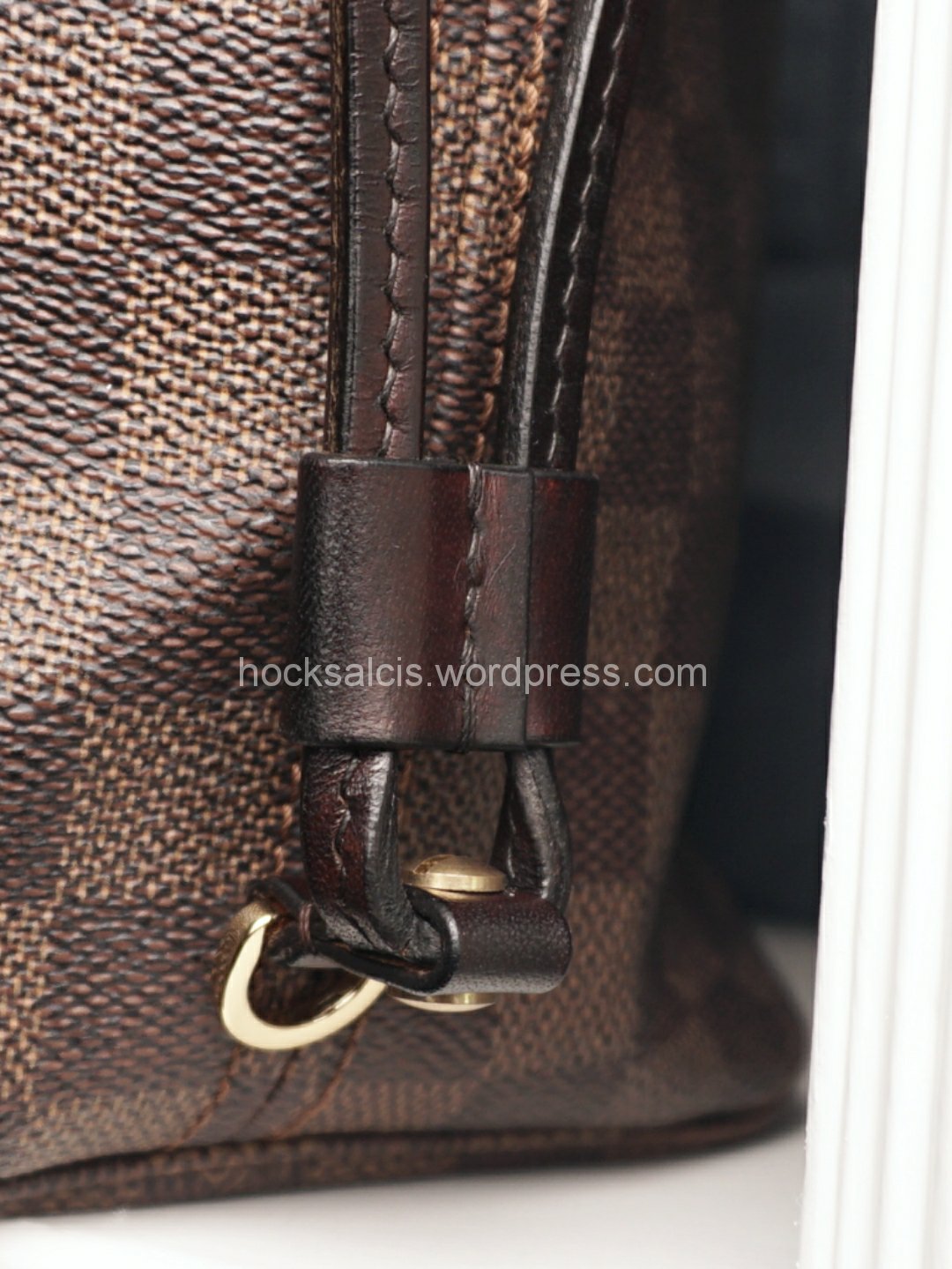 New bag strap replacement attached to D-ring of LV bag