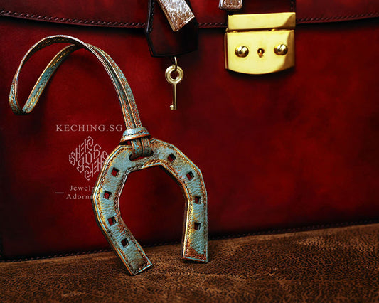 Leather horse shoe bag charm rustic brass rust