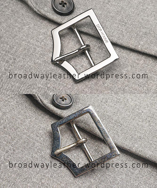 Close-up of two Dior Homme belt buckles in comparison side by side, one before repair and one after repair