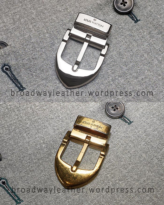Two belt buckles, one worn out gold, and one freshly repaired via re-electroplating in nickel, with 'Louis Vuitton' branding.
